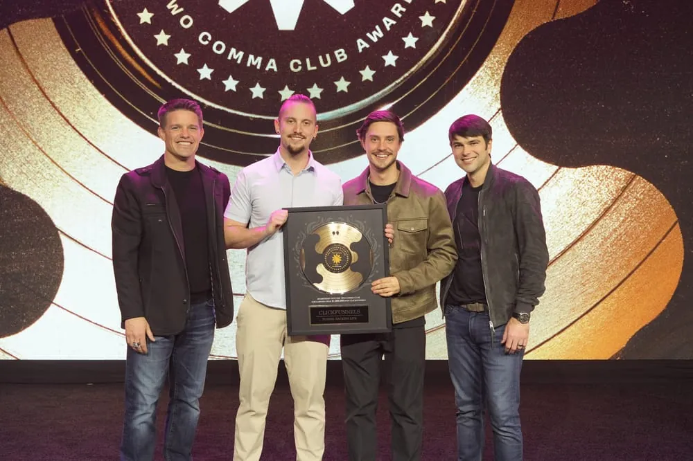 Receiving the Two Comma Club award on stage